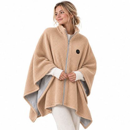Model wearing a beige USB heated shawl with a zip front